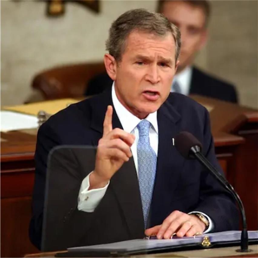 George W. Bush describes Iraq, Iran and North Korea as "axis of evil"