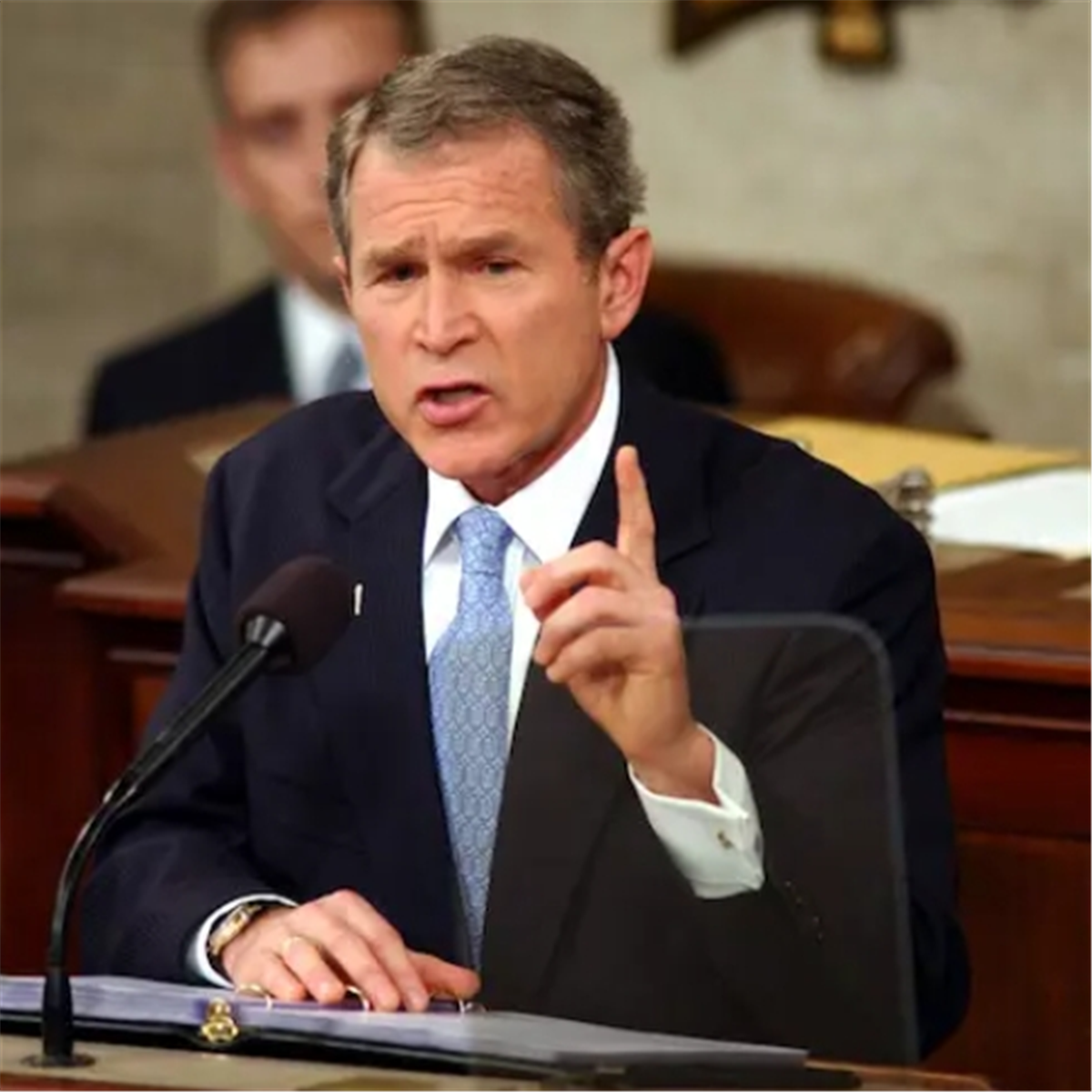 George W. Bush describes Iraq, Iran and North Korea as "axis of evil"