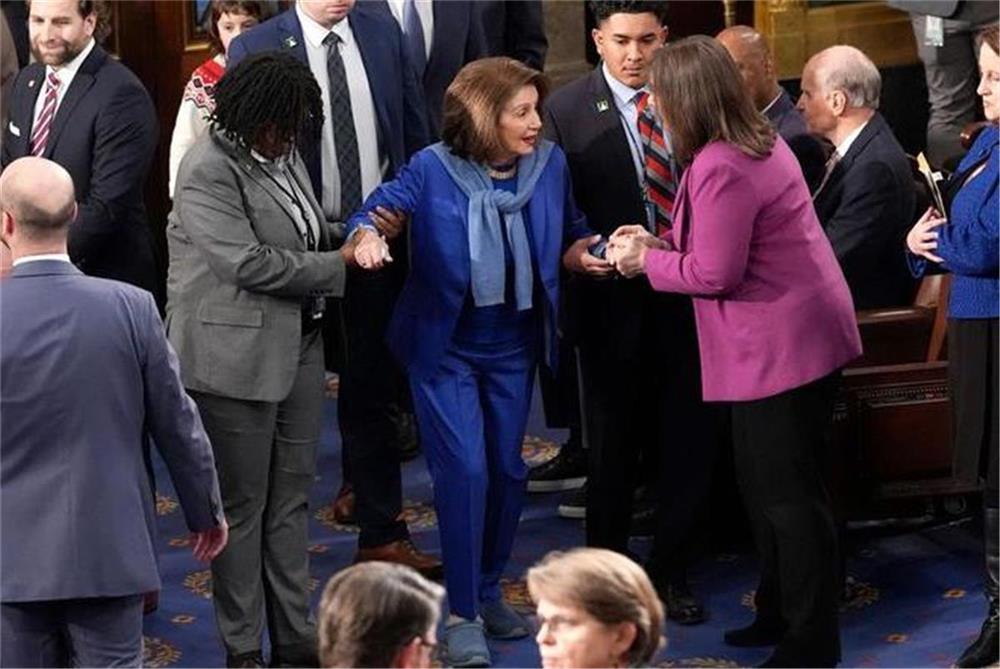 After surgery Pelosi returns to the House for the first time, giving up her signature high heels